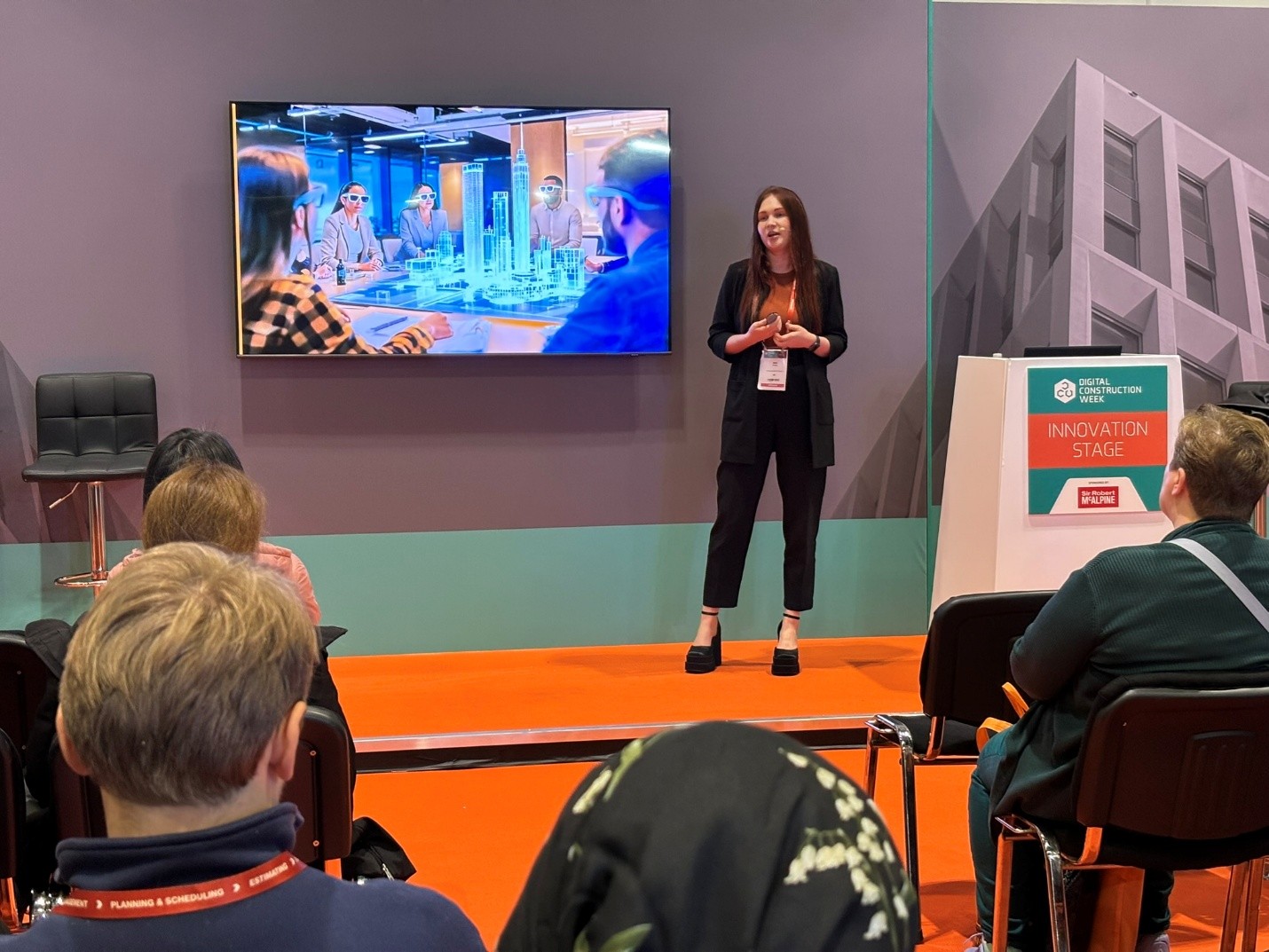 Photo of Anna Mytcul delivering her presentation at DCW2025